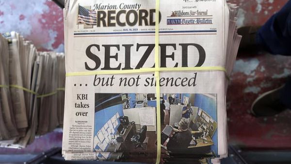 An ex-Kansas police chief who led a raid on a newspaper is charged…