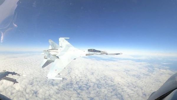 Startling video shows Russian fighter jet flying within feet of...