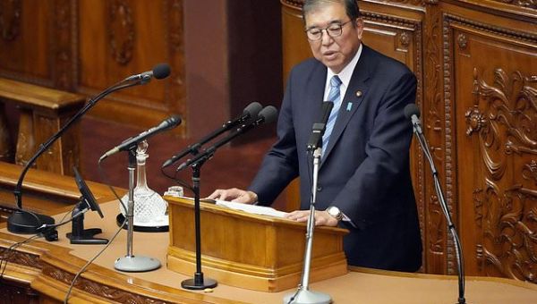 Embattled Japan leader vows to cooperate with long-ignored...