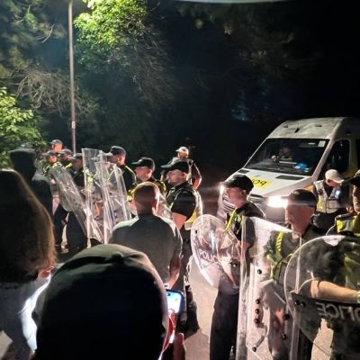 Riot police deployed at protest over migrant boat crossing