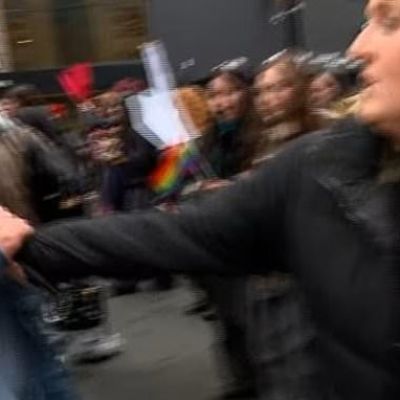 Protester steals reporter’s microphon