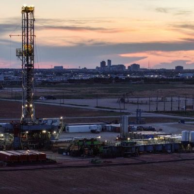 Oil climbs after hitting one-month low; supply glut weighs