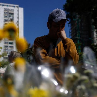 Hong Kong mourns victims of building fire that killed 128 and counting