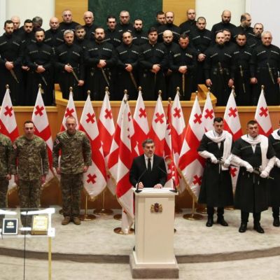 Former Manchester City footballer sworn in as Georgia’s new president amid political showdown