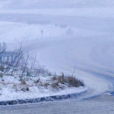 Heavy snow fall closes roads and cancels flights as drivers are urged not to travel unless necessary