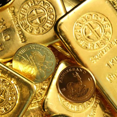 Gold slides from 1-week high on profit-booking, dollar strength