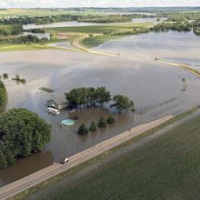 Midwestern flooding collapses a bridge, forces evacuations and kills at least 2