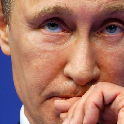 Putin tells Russians there’s no reason to panic as the ruble sinks, but analysts say its economy is in trouble