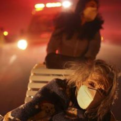 Wildfires burn out of control across Los Angeles area and kill 5 as thousands flee homes