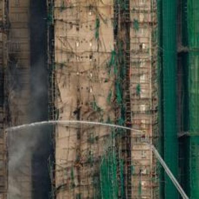 Hong Kong fire death toll rises to 55 as towers burn for a second day