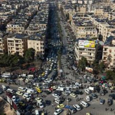 Tens of thousands flee Aleppo neighborhoods as Syrian government clashes with Kurds intensify