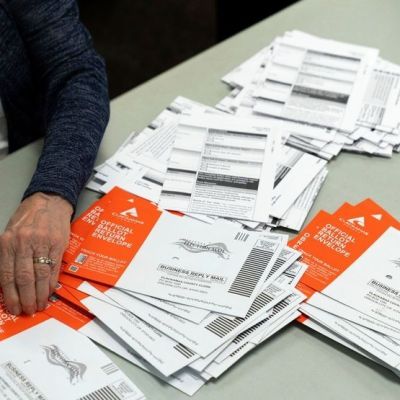 DOJ announces charges against Utah postal worker, pivots to mail voting fight with states