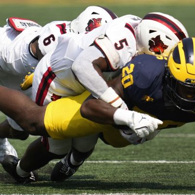 No. 17 Michigan beats Arkansas State 28-18 on the ground, overcoming Davis Warren's 3 interceptions