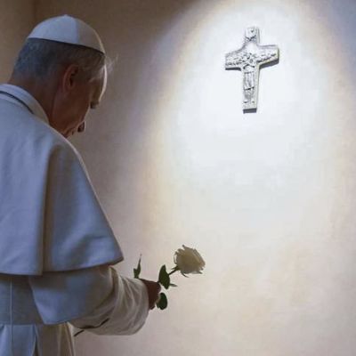 Pope Leo XIV lays a white rose on the tomb of the late Pope Francis