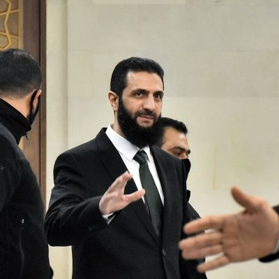 Syria’s new leader says all weapons in country will come under ‘state control’