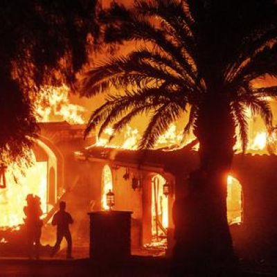 Strong winds push wildfire through Southern California community, burning dozens of homes