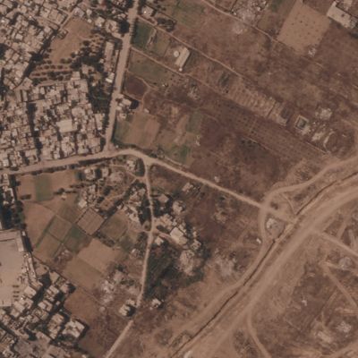 Photos show Israel building a miles-long earthen barrier inside Gaza