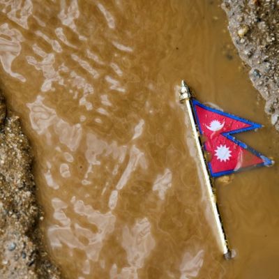 Rescuers comb through mud and debris as Nepal-China floods leave more than 1,000 dead