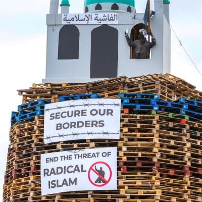 Loyalist bonfire lit early after police begin to remove mosque replica