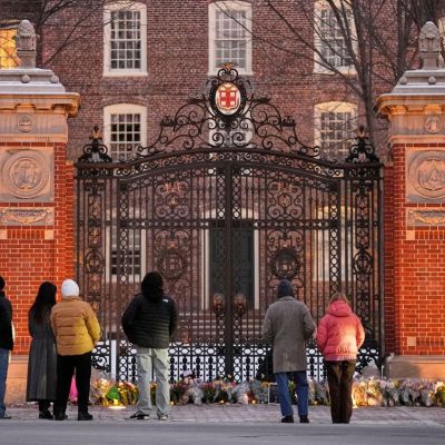 Authorities knock on doors and seek evidence in the search for the Brown University shooter