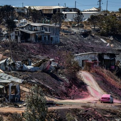 13 homes burnt, dozens damaged in West Bank settlement as crews battle blaze for 2nd day