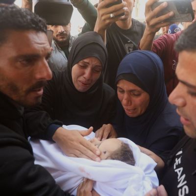 Palestinians hold funerals for pregnant woman and her children killed in Israeli strikes