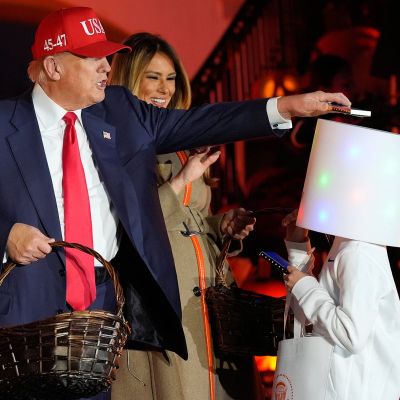 Trump puts candy on kid’s costumed head at White House Halloween event – again