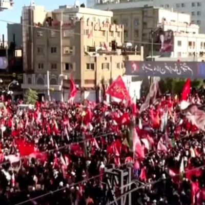 ‘People here all seek revenge’: Crowds mass for Khamenei’s burial, banners call to kill Trump