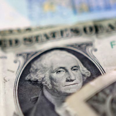 Dollar edges lower after US credit downgrade, Aussie pares losses before RBA