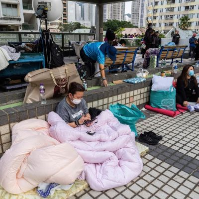At least 55 dead as Hong Kong firefighters battle burning towers for a second day