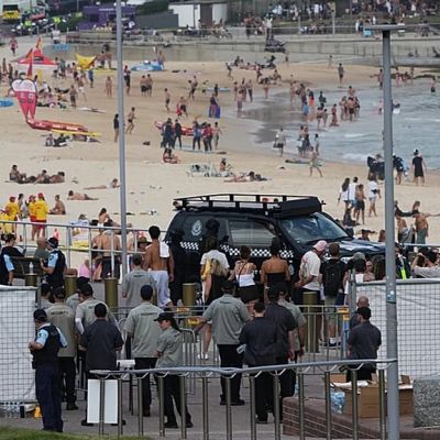 Two gunmen threw homemade bombs that failed to detonate at crowd celebrating Hanukkah in Sydney