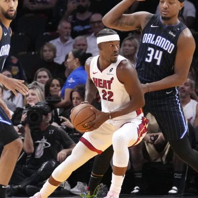 Magic roll past host Heat 116-97 in season opener
