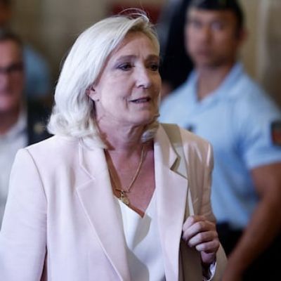 French court opens door for Marine Le Pen to run for president, with ankle monitor
