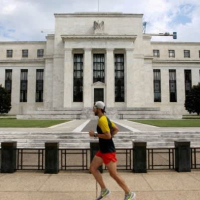 Federal Reserve cuts rates by half a point and signals era of easing has begun
