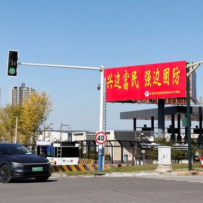 Trucks line up as long-delayed China-North Korea bridge officially opens