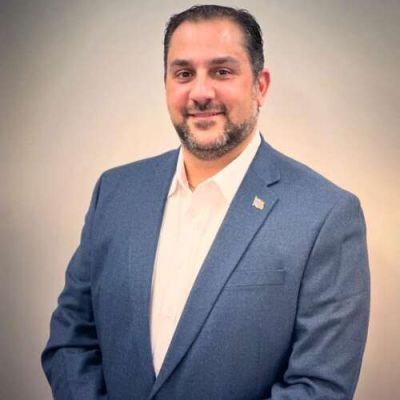 Would Arlington Heights candidate have to forfeit liquor licenses if elected?