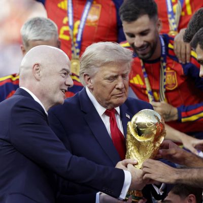 Donald Trump refuses to leave stage as Spain lifts World Cup trophy despite pleas from FIFA president