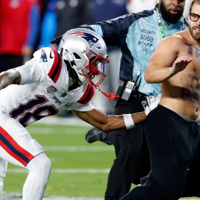 Patriots player Kyle Williams chases down fan who ran onto field during Super Bowl