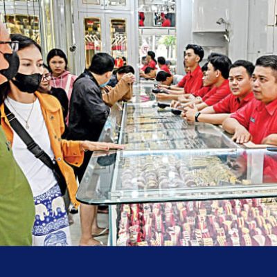 Gold eases from near two-week high as investors book profits