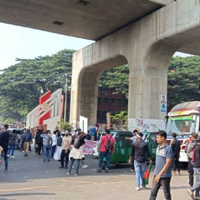 Mobile phone traders block road in Agargaon demanding reforms