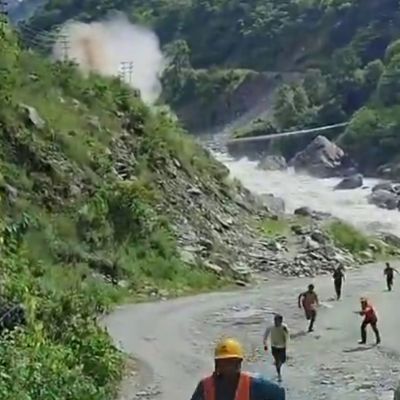 Horror moment workers flee as 50ft tsunami thunders down valley in Nepal