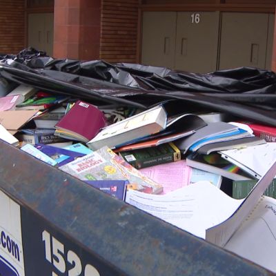 Dumpsters full of books seen outside high school on Chicago’s Northwest Side