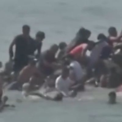 Spanish woman trembles in fear, pleads for help while surrounded by illegal migrants