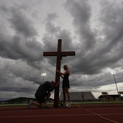 Hundreds gather at high school stadium to honor the many lost to...