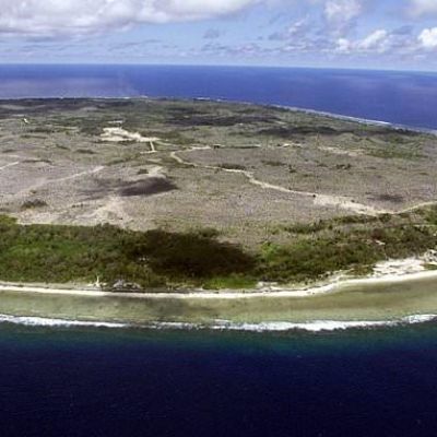 Australia dispatches immigrants to remote Pacific atoll