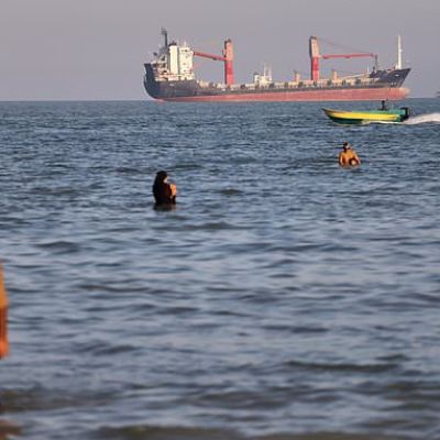 An oil tanker navigates the Strait of Hormuz despite threats from...