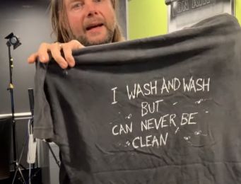 Depicts band members with the phrase "I wash and I wash and can never be clean"