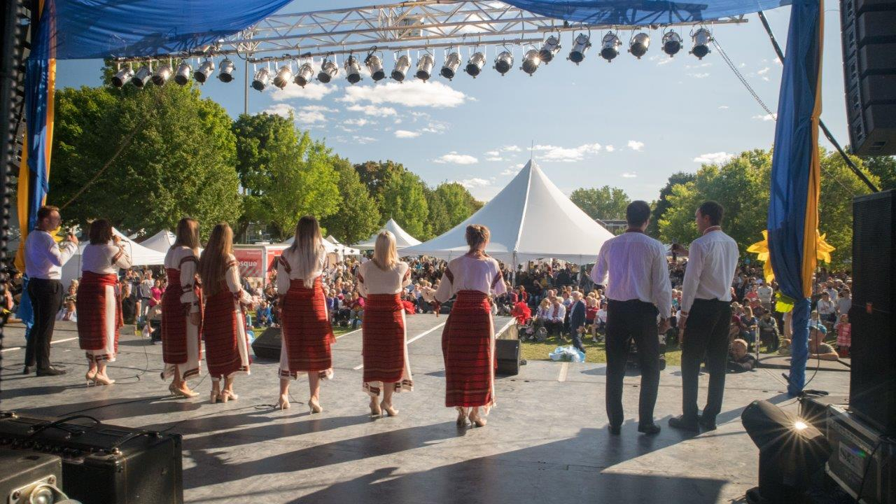 A group of people standing in front of a crowd at the Montreal Ukrainian festival