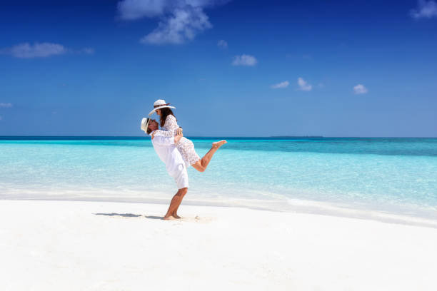 couple-in-white-summer-clothes-on-a-tropical-beach
