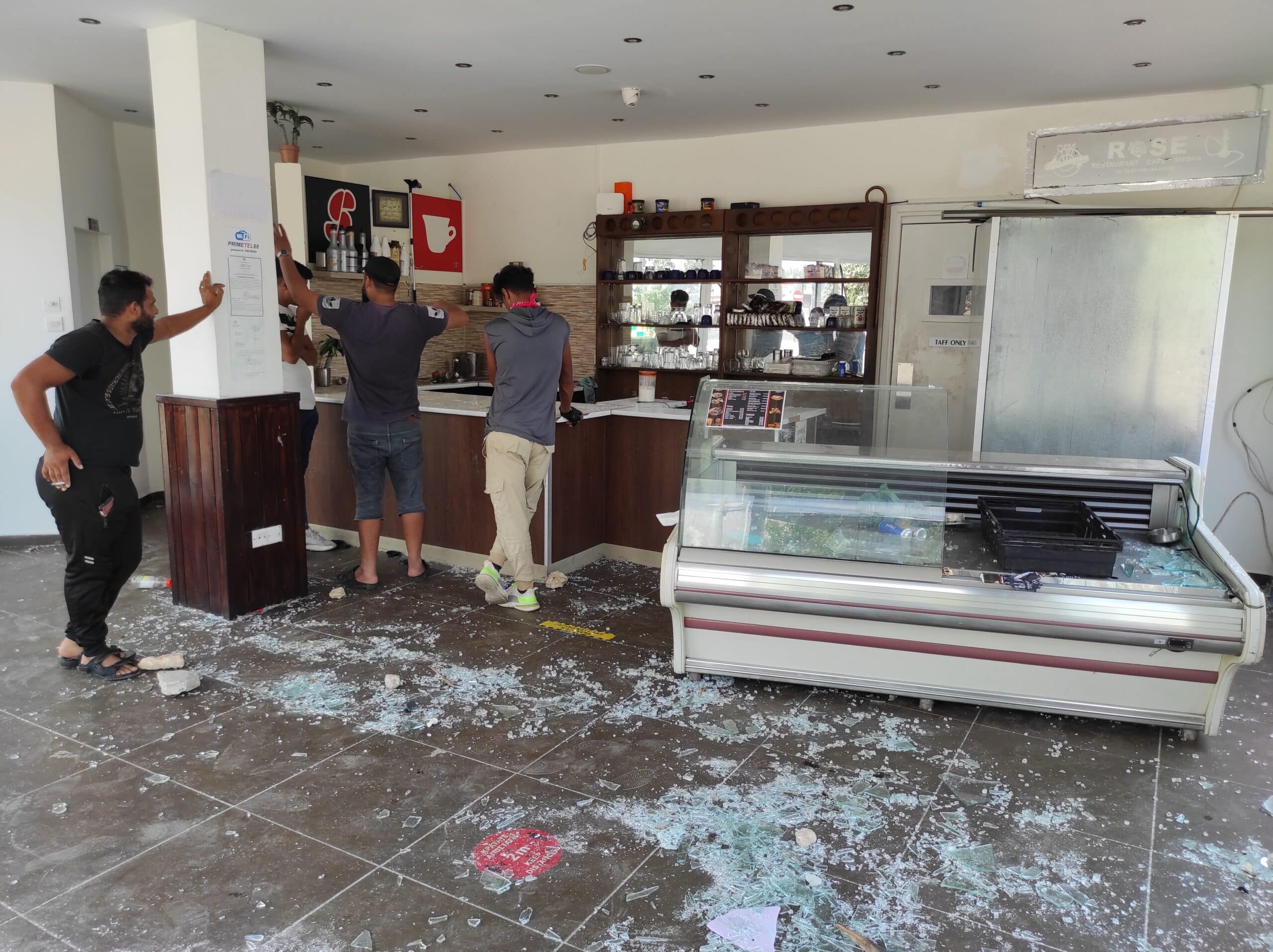 feature-kyriacos-main-A-destroyed-shop-in-Chlorakas-scaled-1